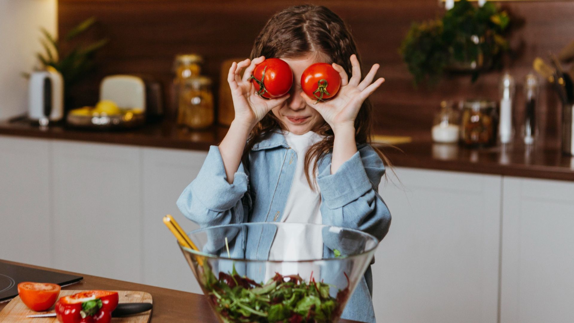 little girl playing with tomatoes at me & salads bangalote